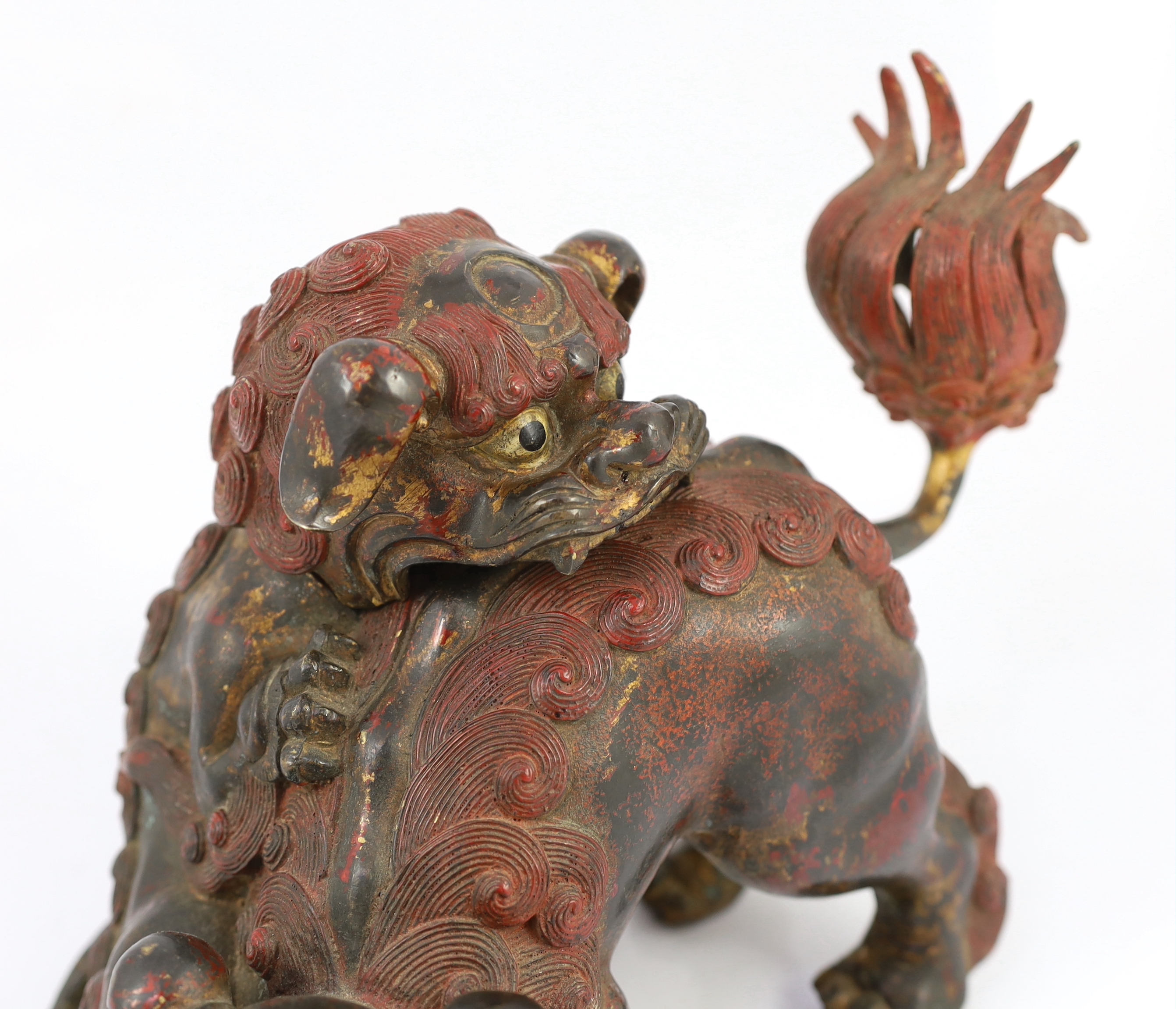 A large Japanese gilt and red lacquered bronze ‘shi-shi’ koro and cover, Edo period